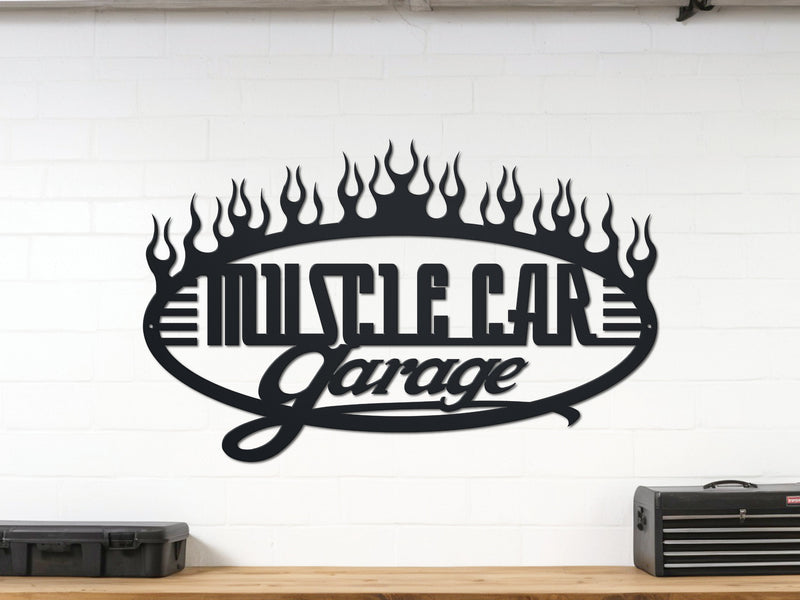 Decorative metal sign with 'Muscle Car Garage' text on a white wall.