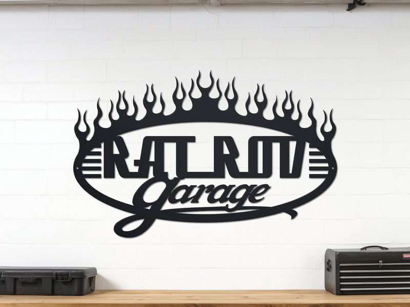 Metal wall art with 'Rat Rod Garage' design on a white wall.